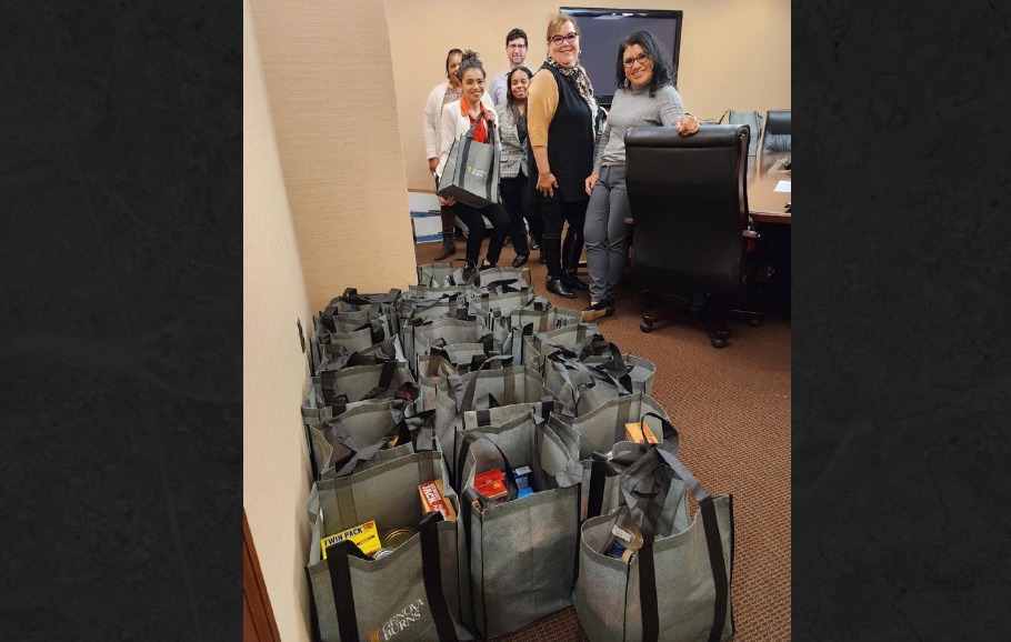 Genova Burns volunteers pictured with donated bags for 